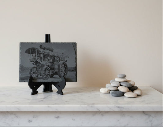 A striking laser-engraved slate featuring a detailed Traction engine design